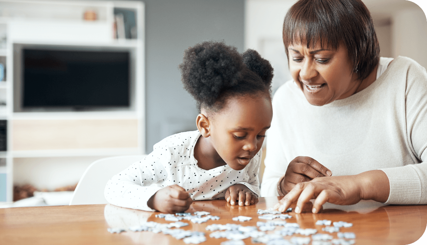 Image of a woman and child putting together a jigsaw puzzle