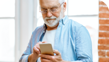 Image of a man looking at a smartphone
