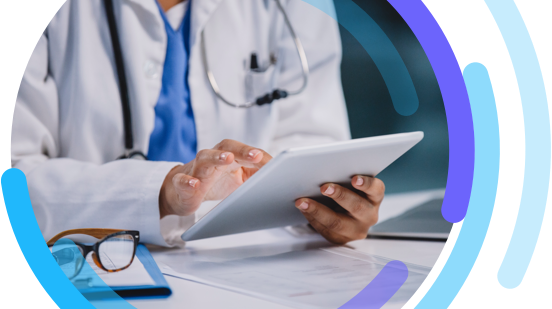 Image of a healthcare professional using a digital tablet in their office