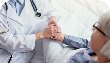 Image of doctor holding a patient's hand