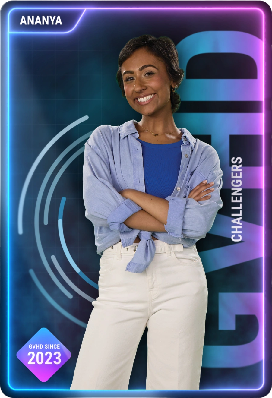 Open patient story: young woman with short hair in blue shirt and white pants smiling with hands on hips.