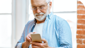 Image of a man looking at a smartphone
