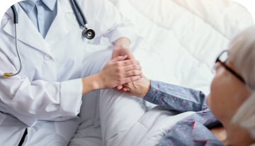 Image of doctor holding a patient's hand