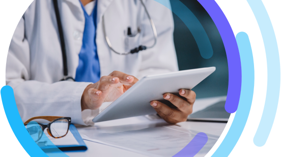 Image of a healthcare professional using a digital tablet in their office